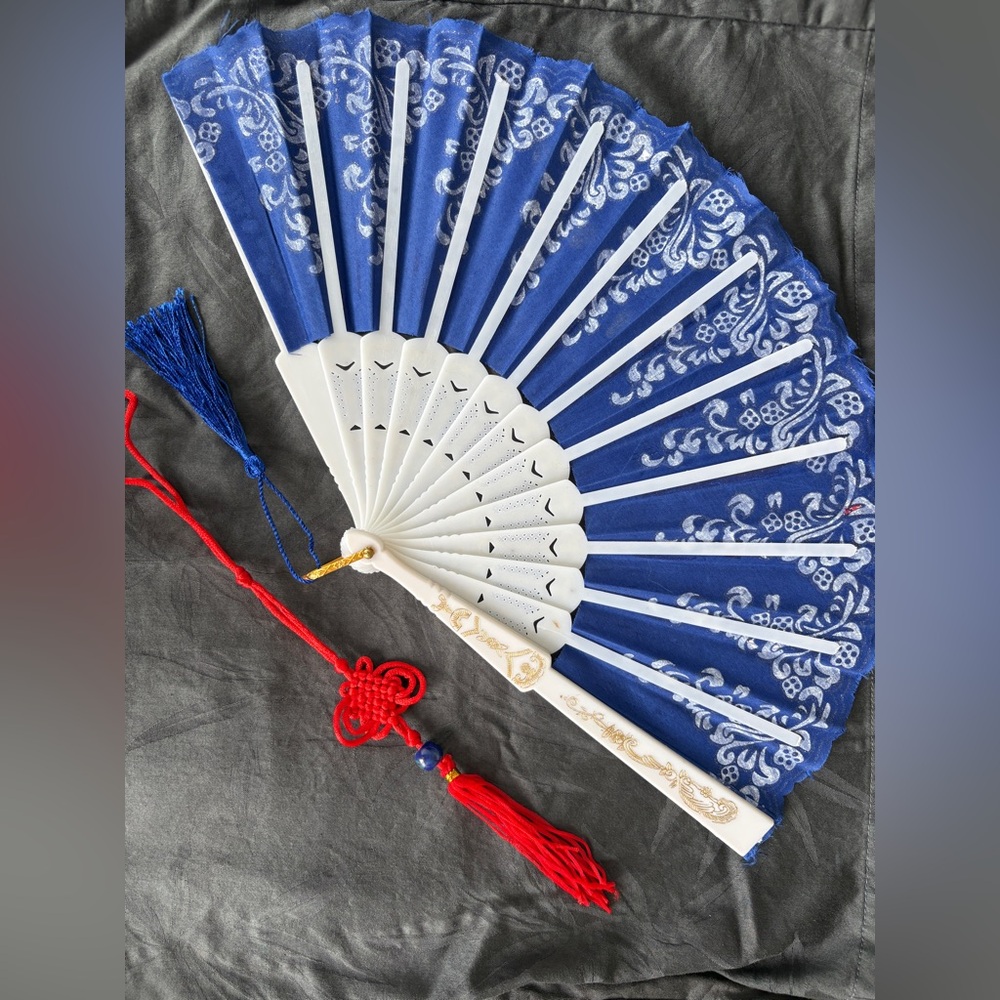 Elegant Blue and White Hand Fan with Red Tassel